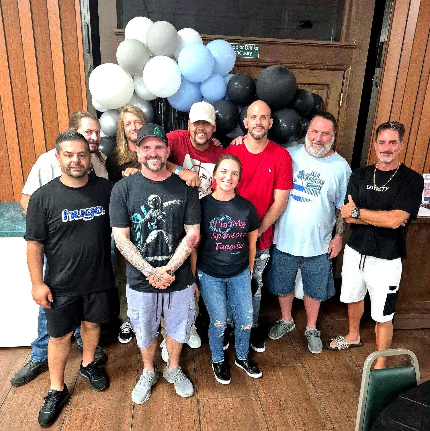 Steadfast Recovery group photo with balloons
