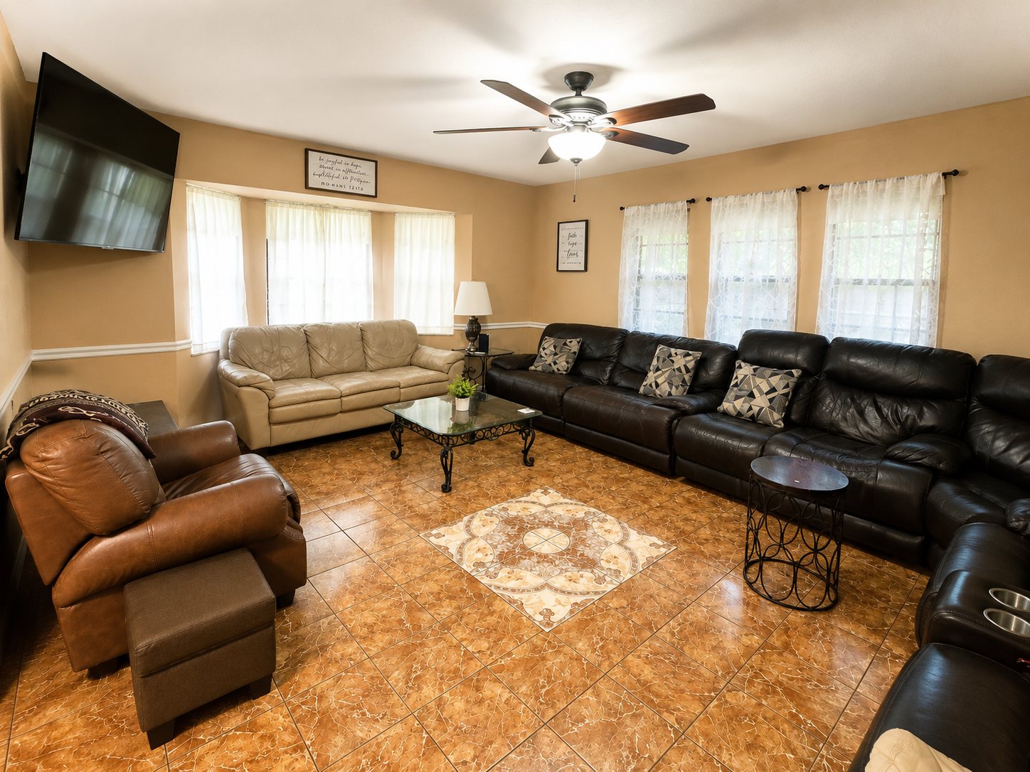 Large shared living room with couches and a television